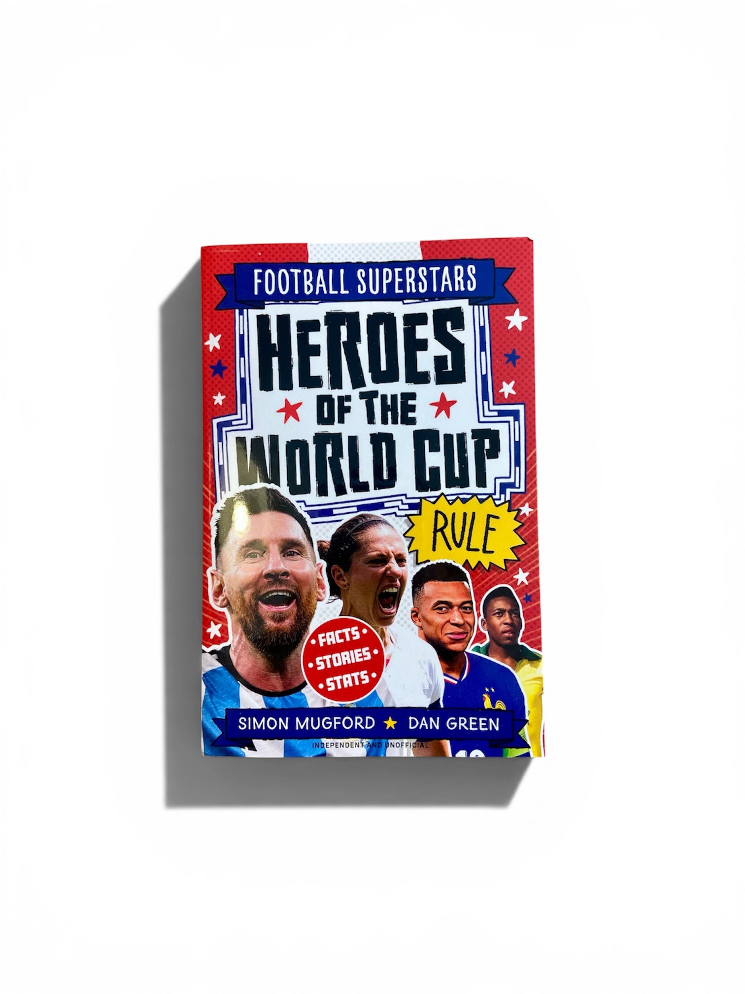 A book titled 'Football Superstars Heroes of the World Cup Rule' by Simon Mugford and Dan Green, featuring a colorful cover with images of football players and bold typography, shown on a white background with a soft shadow.